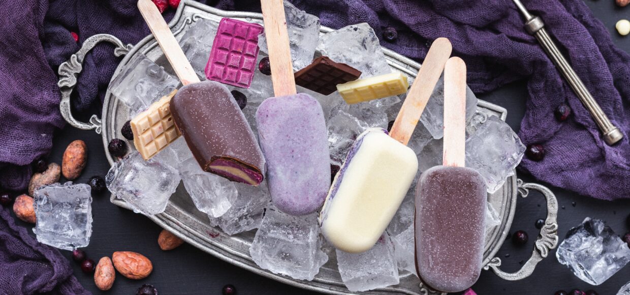 vertical shot home made vegan icecreams chocolate bars ice cubes metal plate scaled