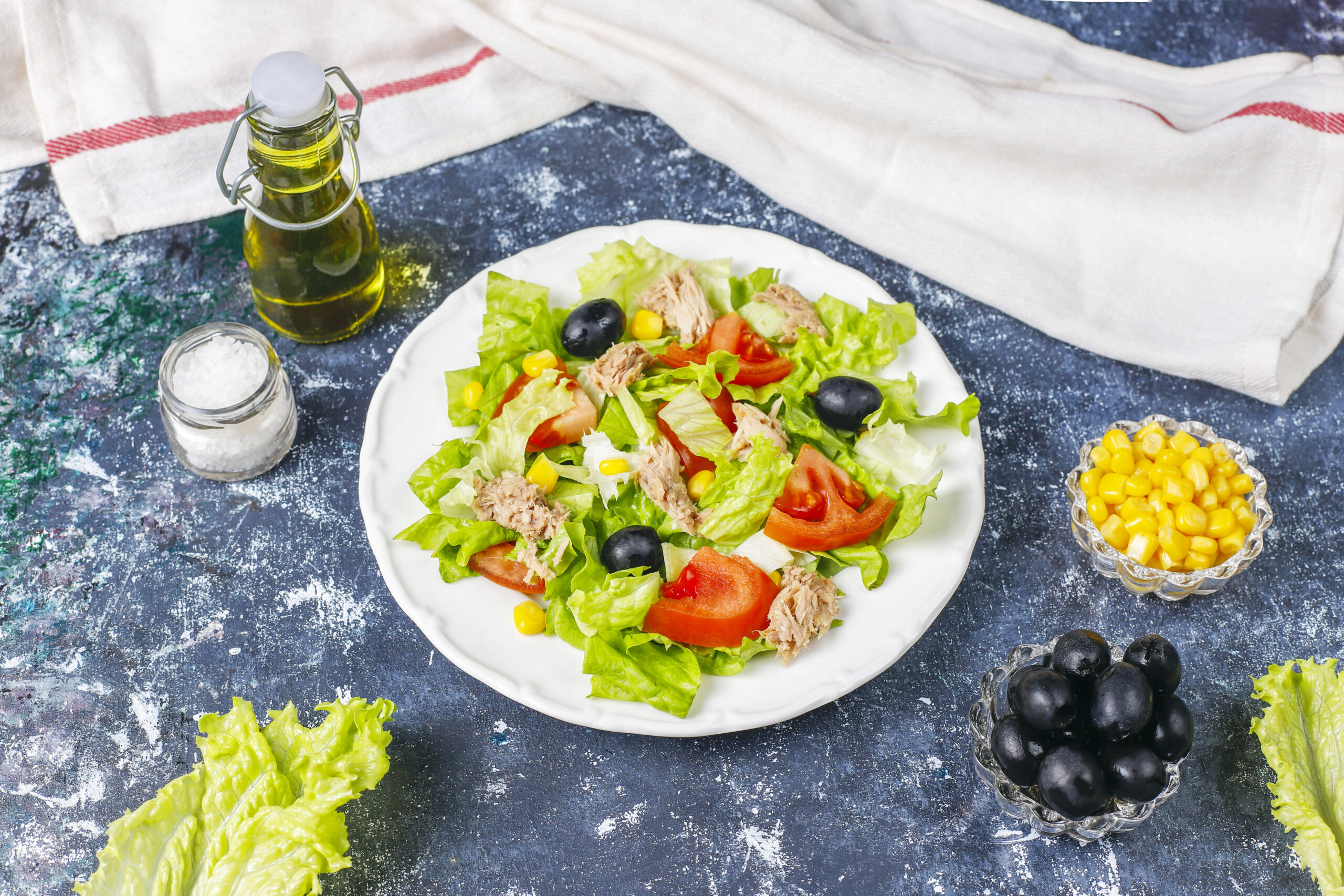 tuna salad with lettuce olives corn tomatoes scaled